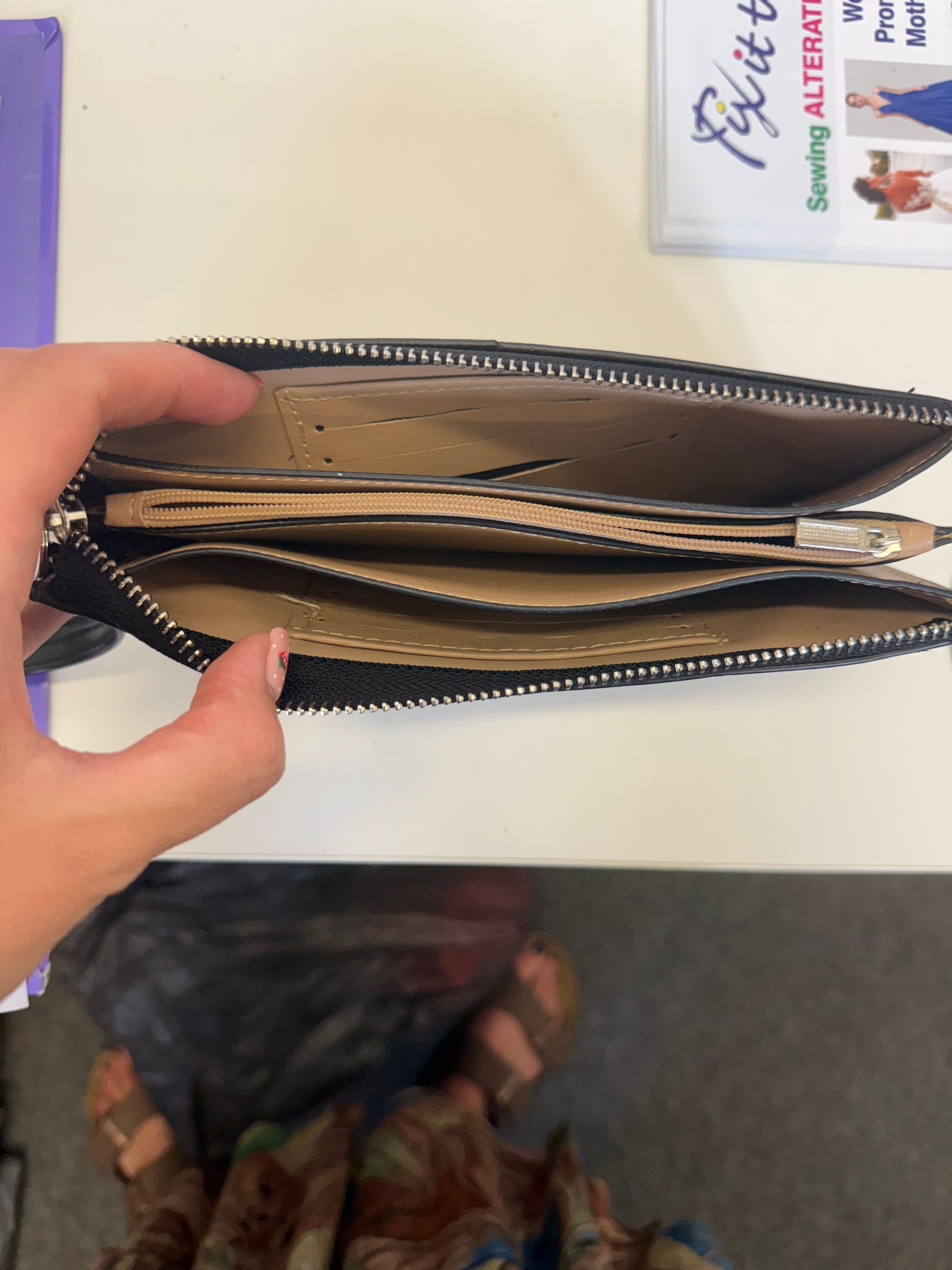 Small black clutch with arm strap