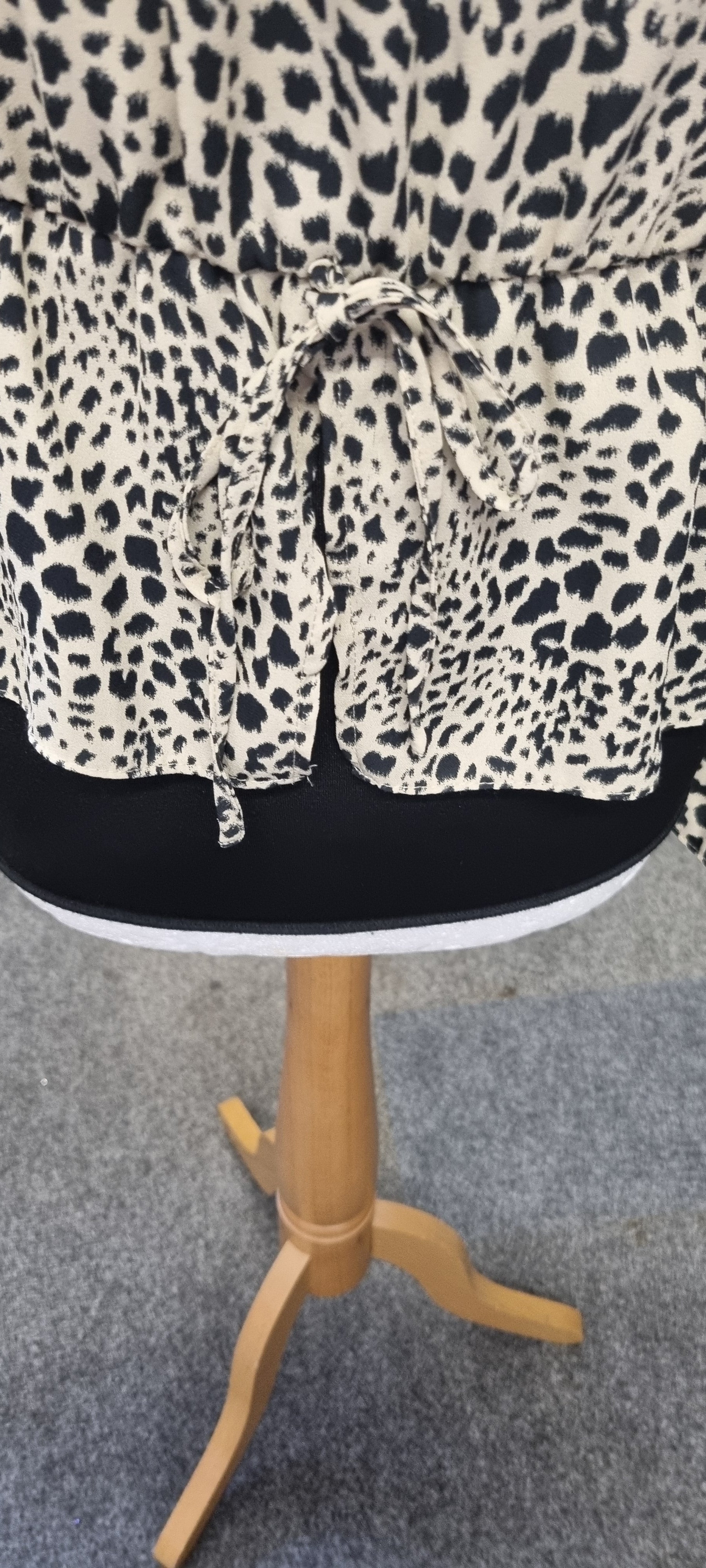 Leopard print peplum long sleeved top