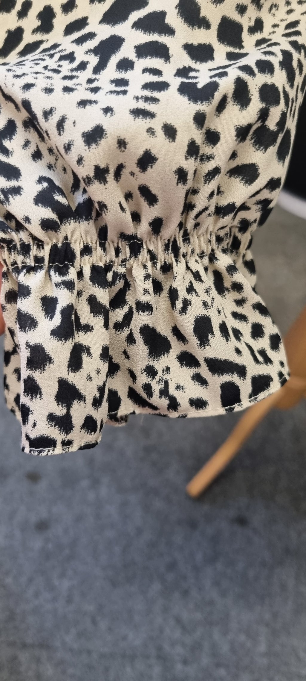 Leopard print peplum long sleeved top