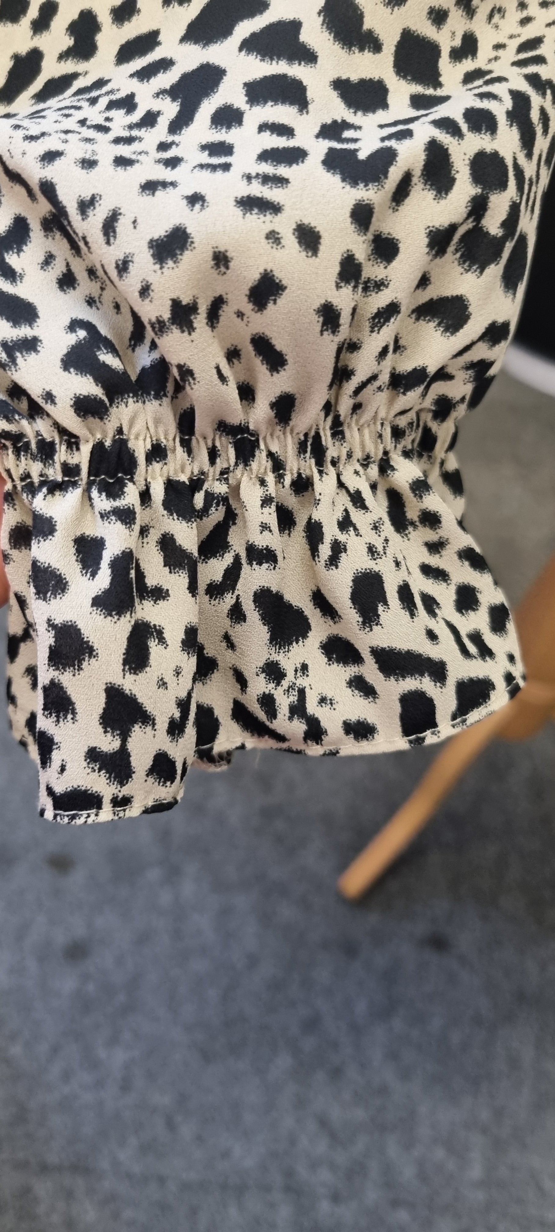 Leopard print peplum long sleeved top