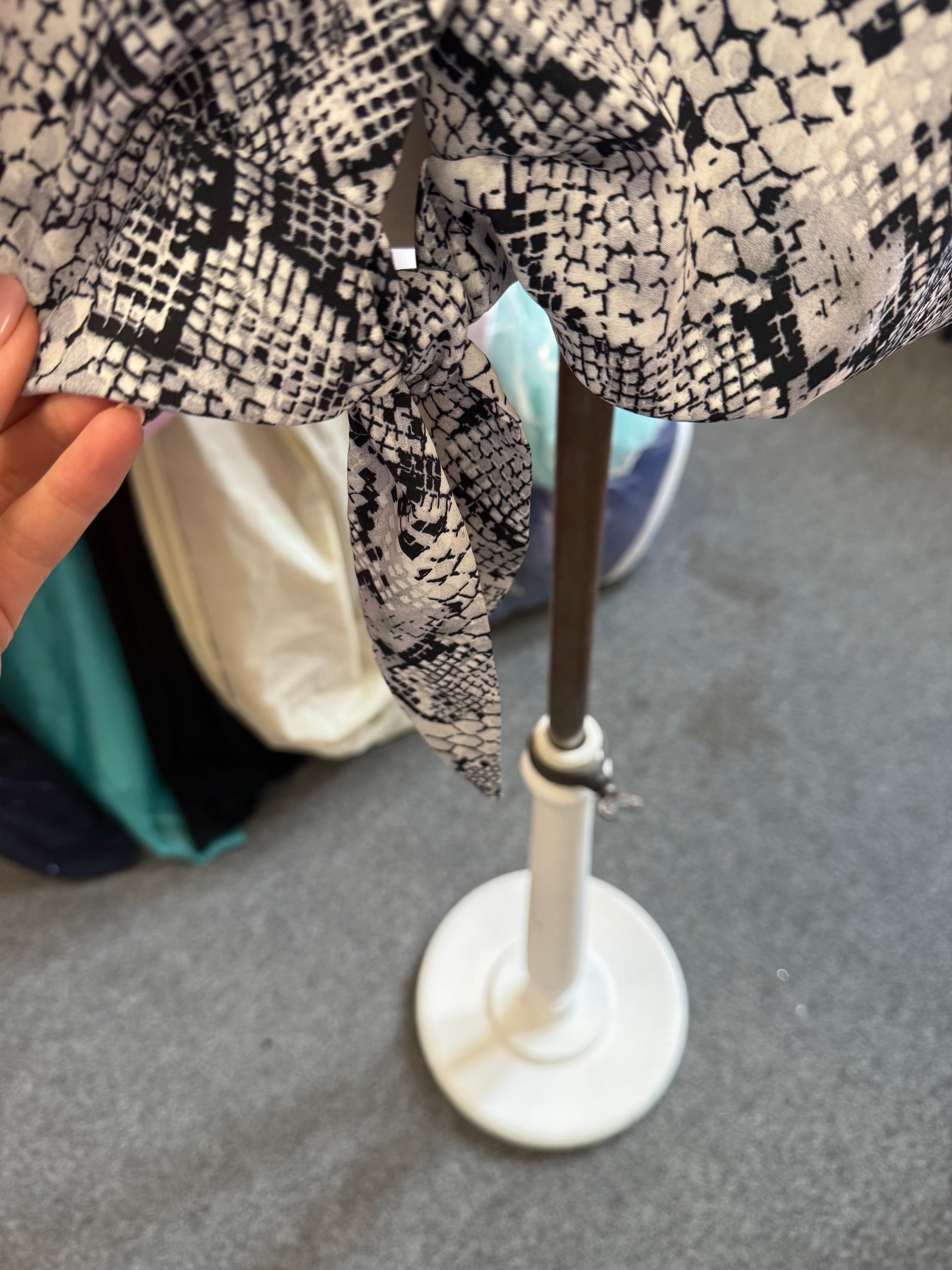 George snakeskin button tie bottom blouse