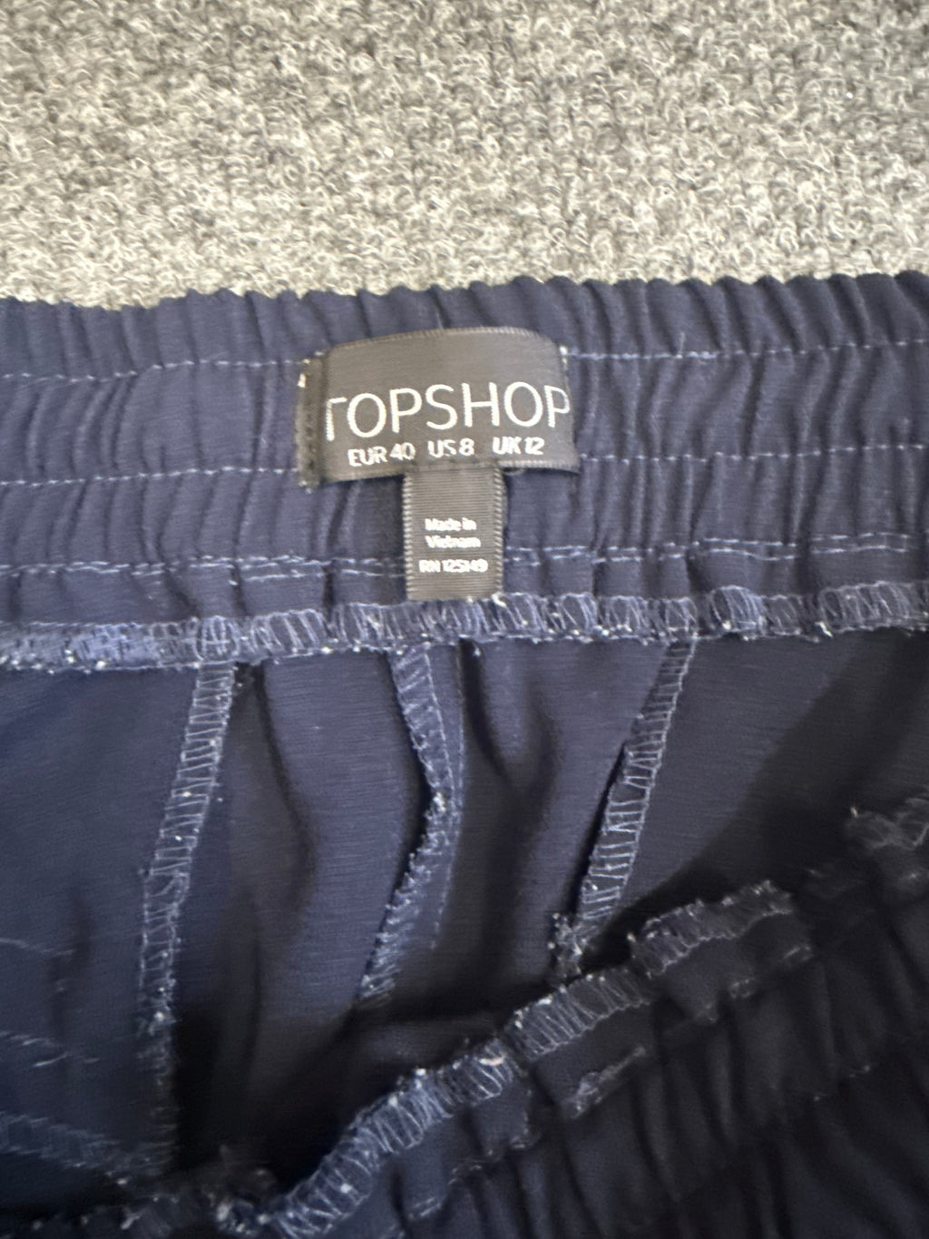Topshop navy tapered casual zip bottom trousers