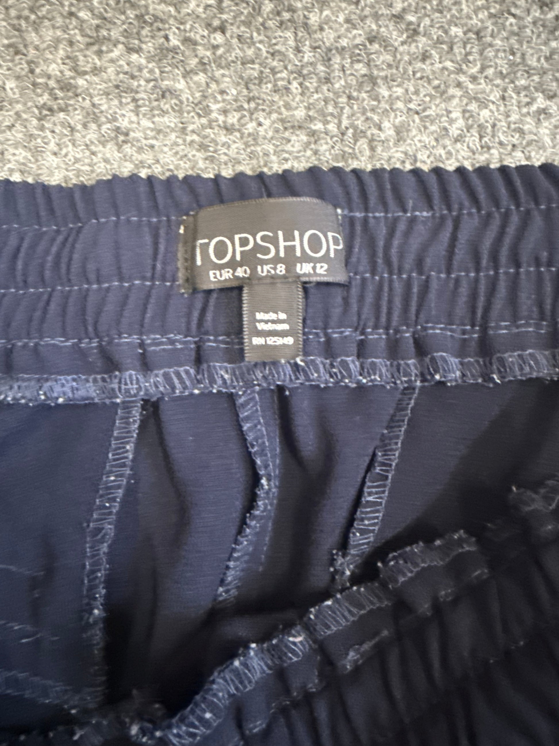 Topshop navy tapered casual zip bottom trousers