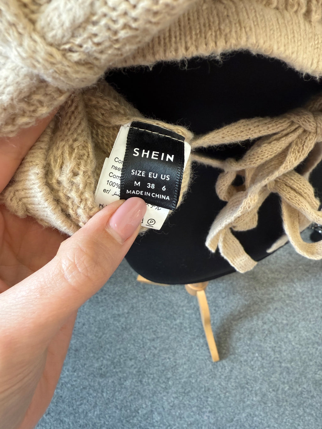 Cropped cable knit tie back jumper