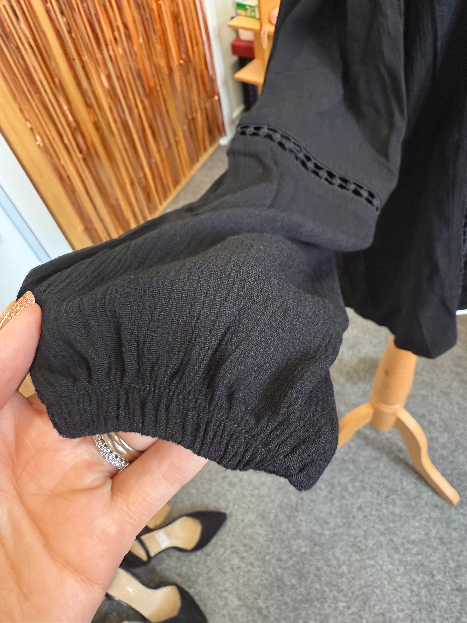 Select black off the shoulder long sleeve top