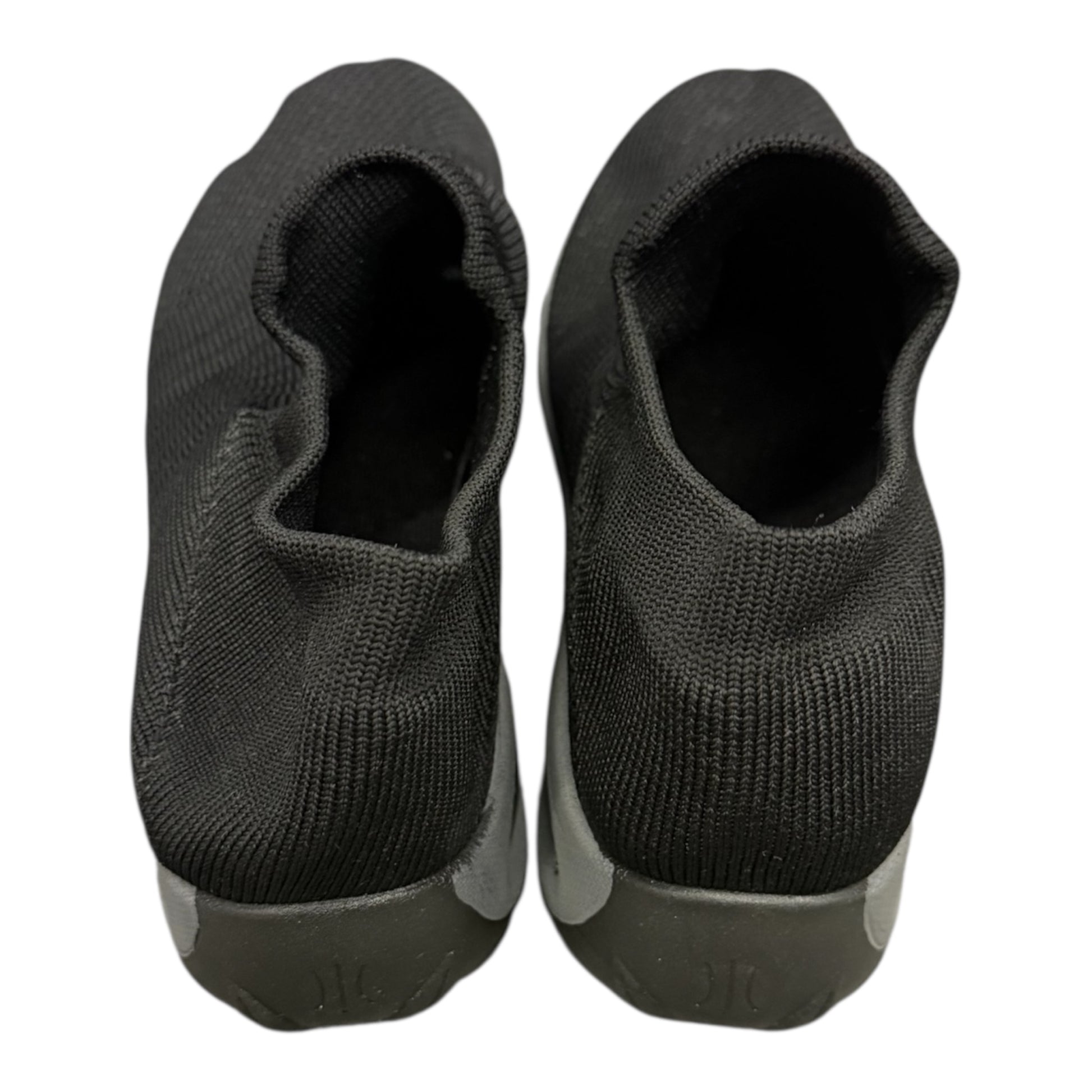 Black soft slip on trainers