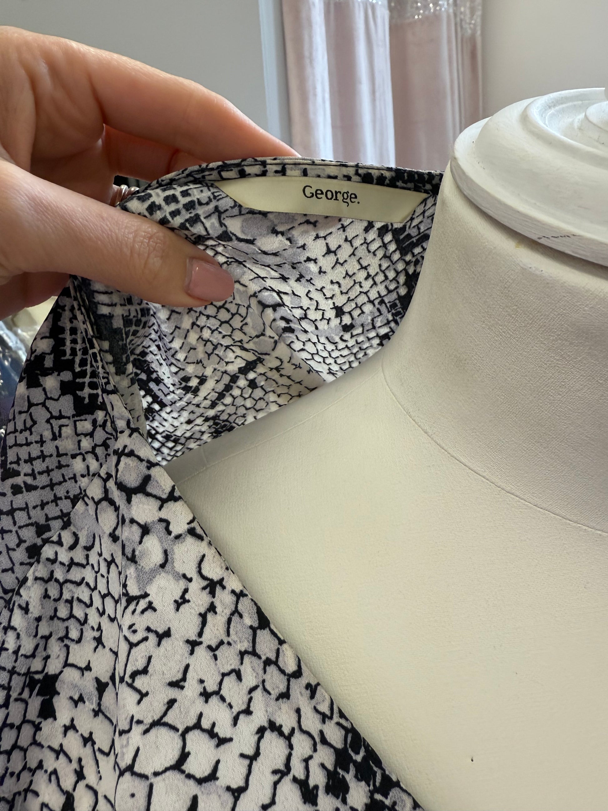 George snakeskin button tie bottom blouse