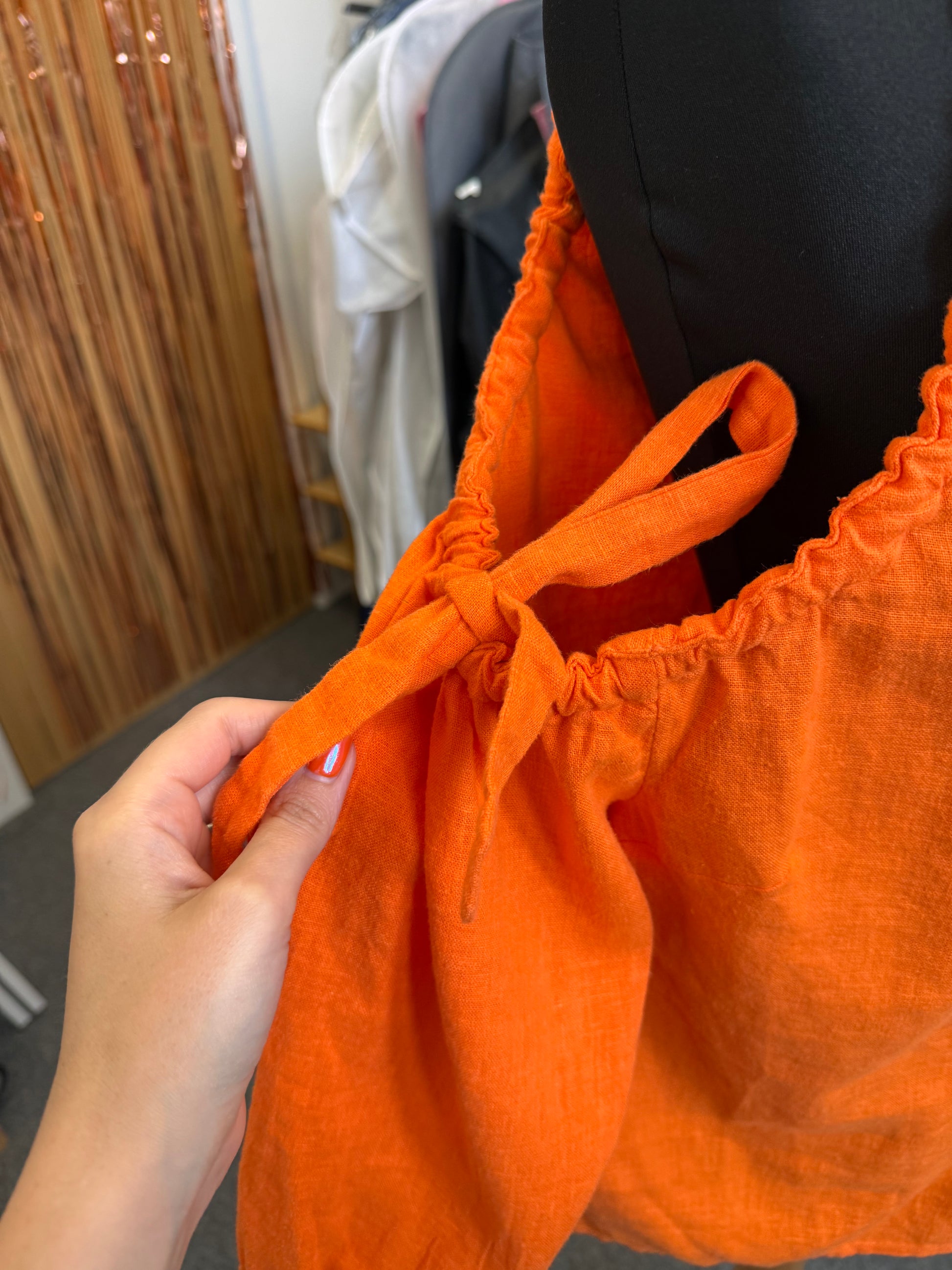Very orange cold shoulder linen style top