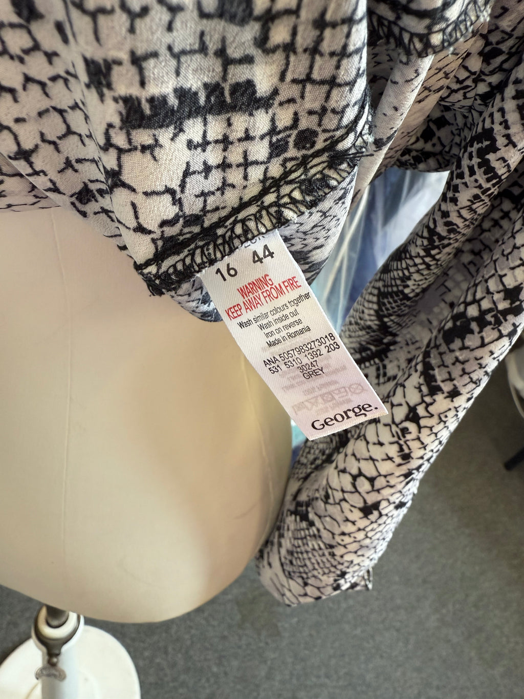 George snakeskin button tie bottom blouse