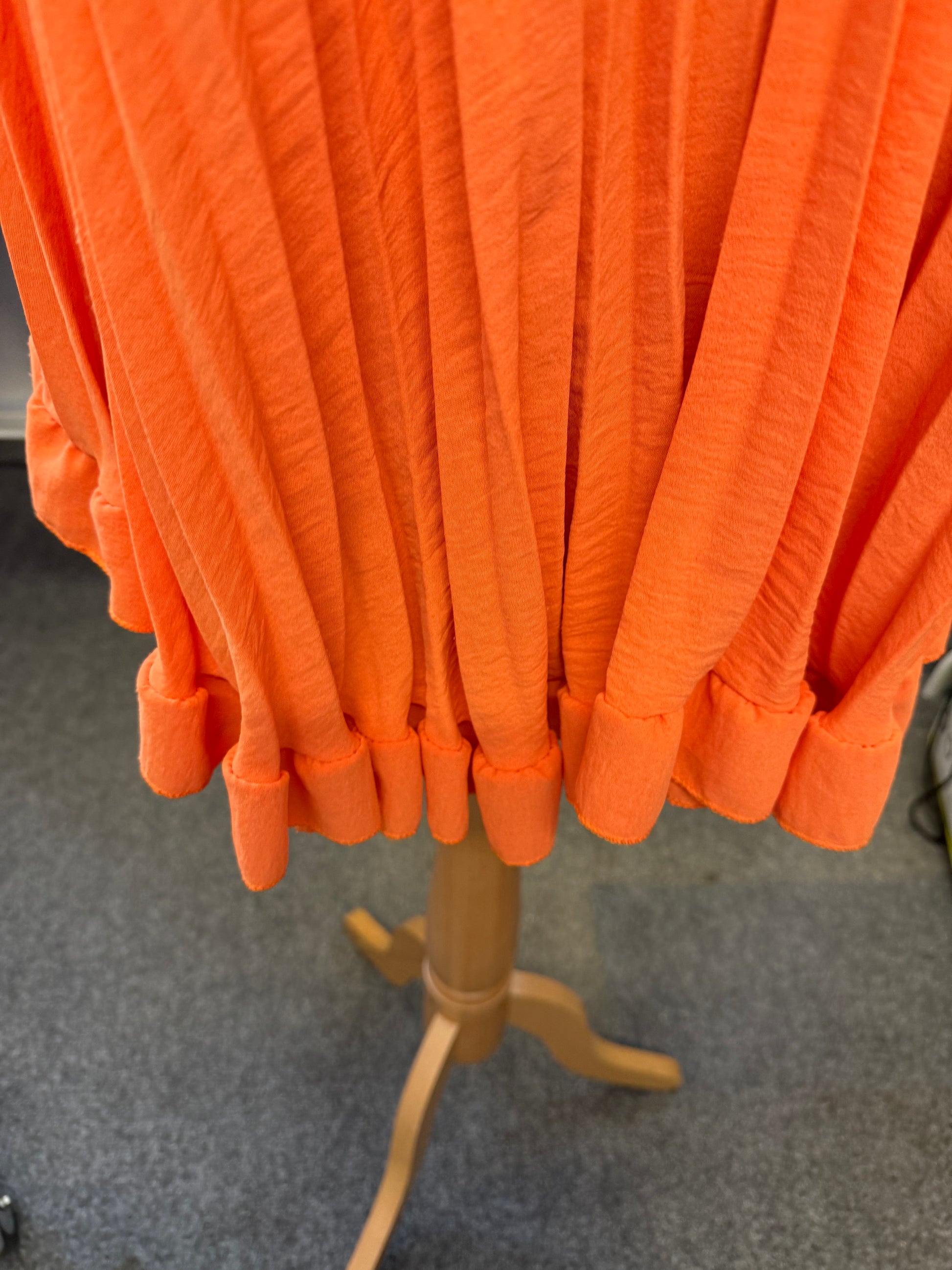 Orange pleat top